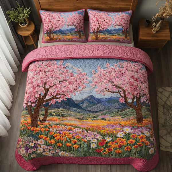Blossom Valley quilted 3-piece bedding set on a made bed with two matching pillow shams