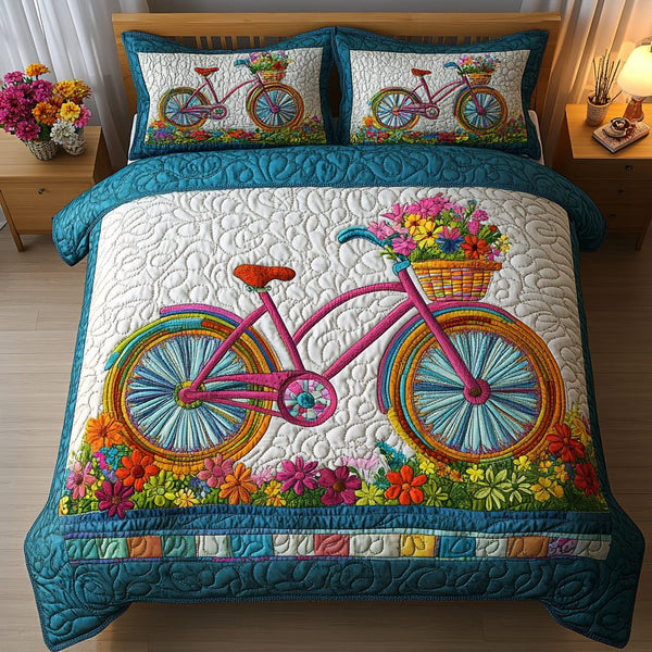 Blossom Wheels quilted 3-piece bedding set on a made bed with two matching pillow shams