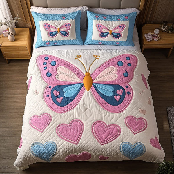 Blossom Wings quilted 3-piece bedding set on a made bed with two matching pillow shams