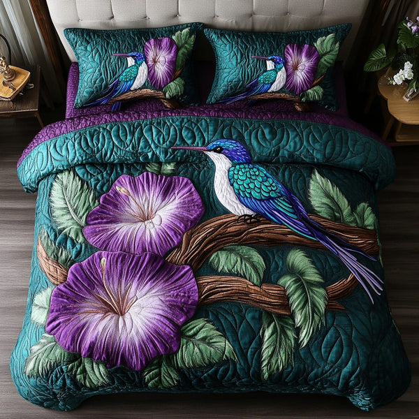 Blossom Wings quilted 3-piece bedding set on a made bed with two matching pillow shams