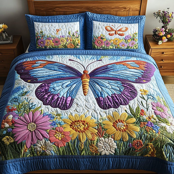 Blossom Wings quilted 3-piece bedding set on a made bed with two matching pillow shams