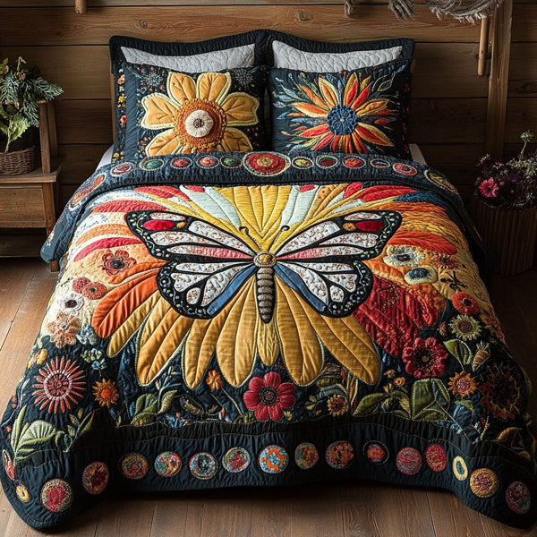 Blossom Wingscape quilted 3-piece bedding set on a made bed with two matching pillow shams