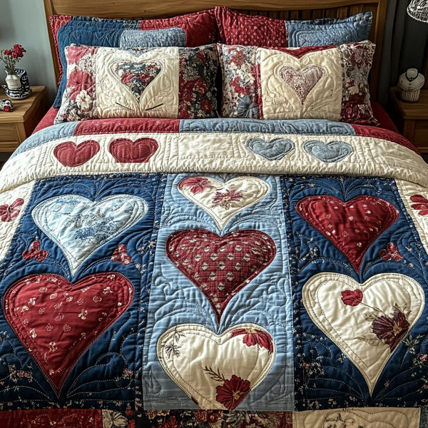 Blossoming Hearts quilted 3-piece bedding set on a made bed with two matching pillow shams