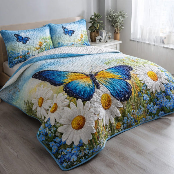 Blue Butterfly quilted 3-piece bedding set on a made bed with two matching pillow shams