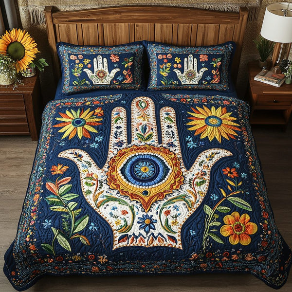 Blue Charm quilted 3-piece bedding set on a made bed with two matching pillow shams