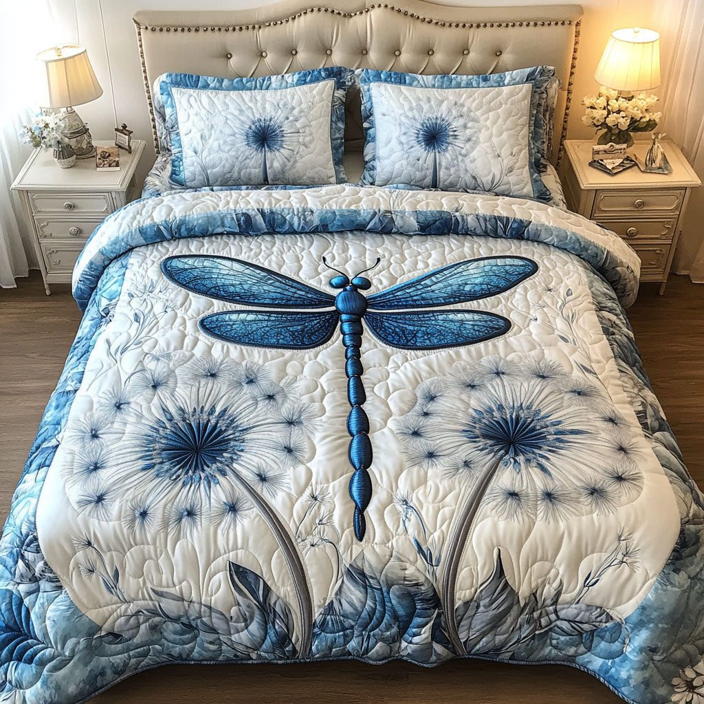 Blue Dragonfly Dreams quilted 3-piece bedding set on a made bed with two matching pillow shams