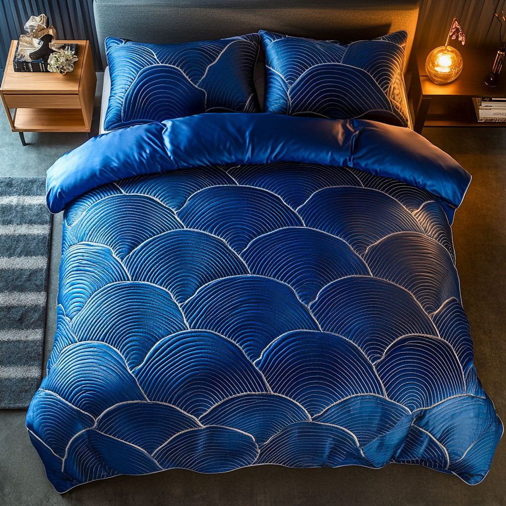 Blue Eclipse quilted 3-piece bedding set on a made bed with two matching pillow shams