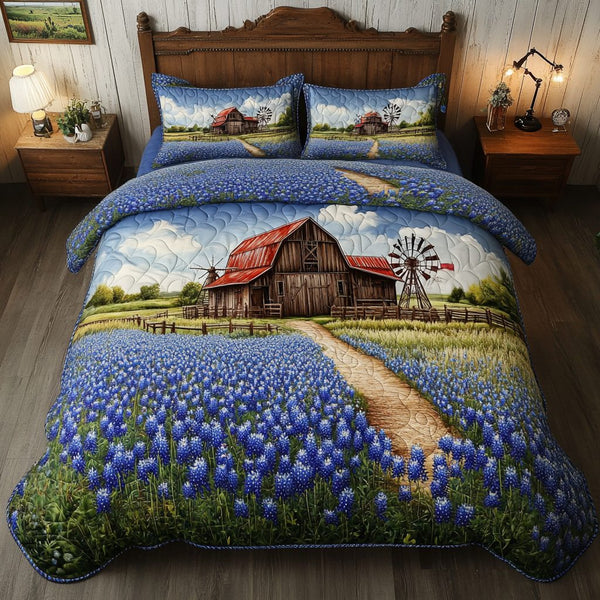 Blue Fields quilted 3-piece bedding set on a made bed with two matching pillow shams