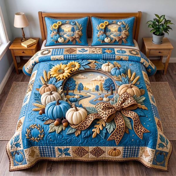 Blue Harvest quilted 3-piece bedding set on a made bed with two matching pillow shams
