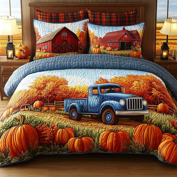 Blue Harvest quilted 3-piece bedding set on a made bed with two matching pillow shams