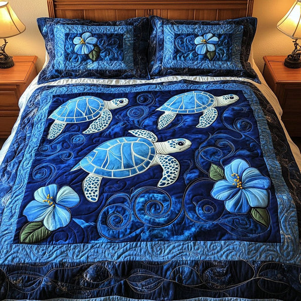 Blue Hibiscus Turtles quilted 3-piece bedding set on a made bed in a light coastal bedroom