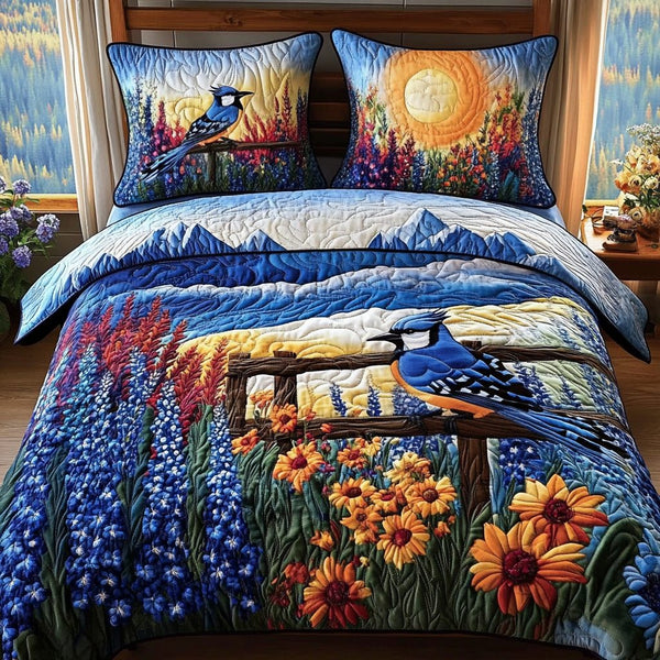 Blue Jewel quilted 3-piece bedding set on a made bed with two matching pillow shams