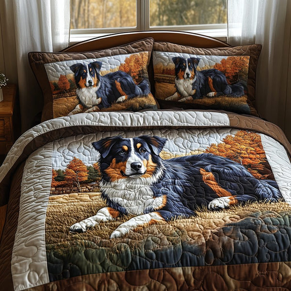 Blue Merle Dreams quilted 3-piece bedding set on a made bed with two matching pillow shams