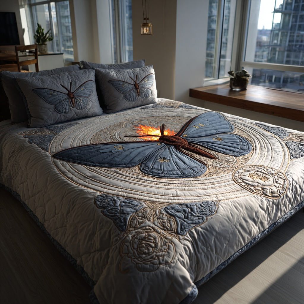 Blue Moth quilted 3-piece bedding set on a made bed with two matching pillow shams