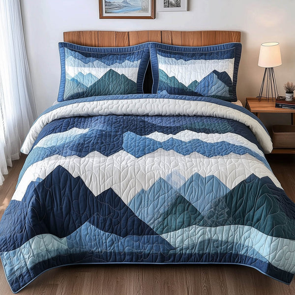 Blue Mountain quilted 3-piece bedding set on a made bed with two matching pillow shams