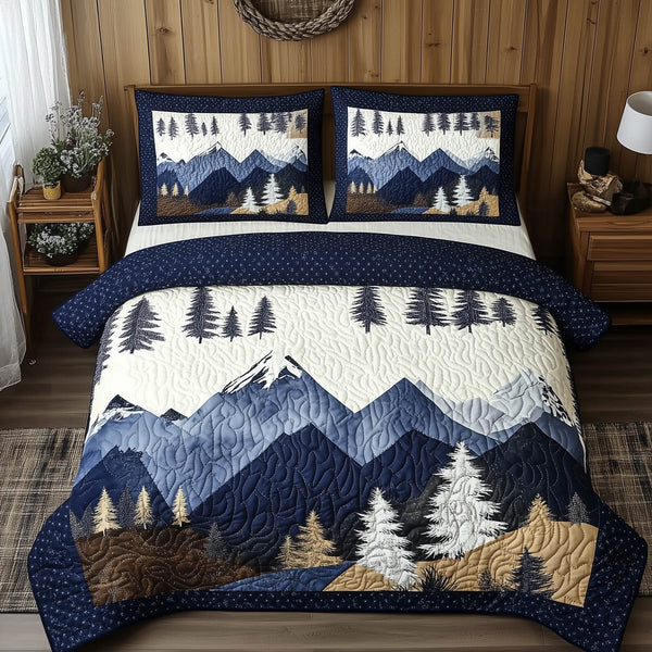 Blue Mountain quilted 3-piece bedding set on a made bed with two matching pillow shams