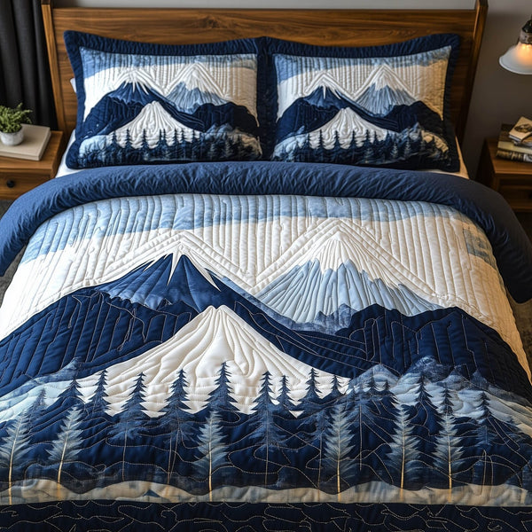 Blue Mountain quilted 3-piece bedding set on a made bed with two matching pillow shams
