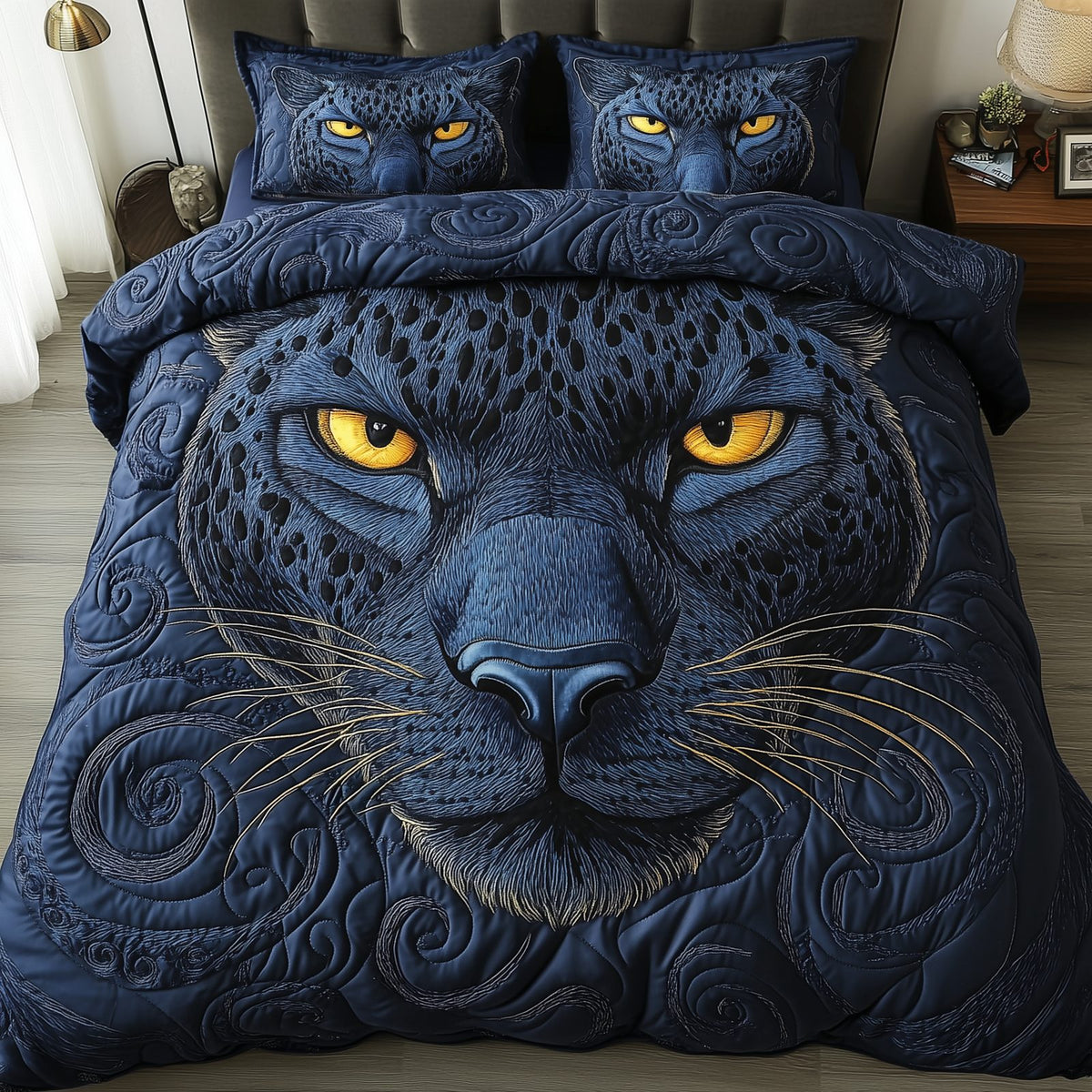 Blue Panther quilted 3-piece bedding set on a made bed with two matching pillow shams
