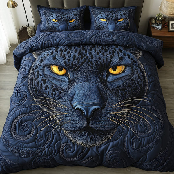 Blue Panther quilted 3-piece bedding set on a made bed with two matching pillow shams