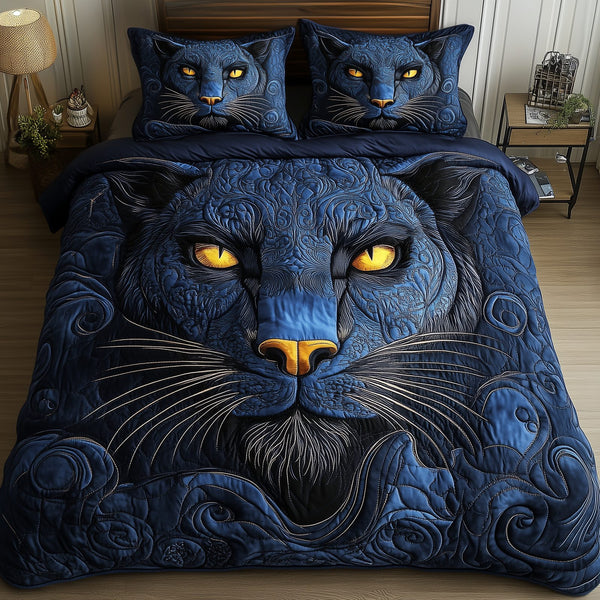 Blue Panther quilted 3-piece bedding set on a made bed with two matching pillow shams