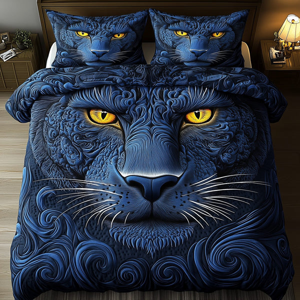 Blue Panther quilted 3-piece bedding set on a made bed with two matching pillow shams