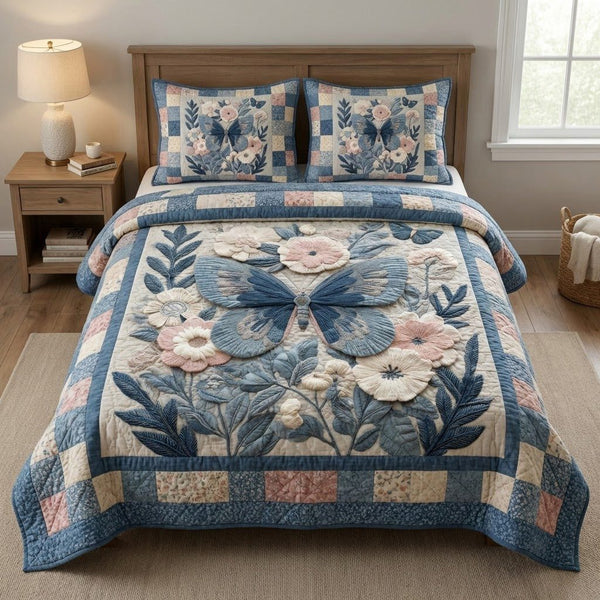 Blue Petal quilted 3-piece bedding set on a made bed with two matching pillow shams