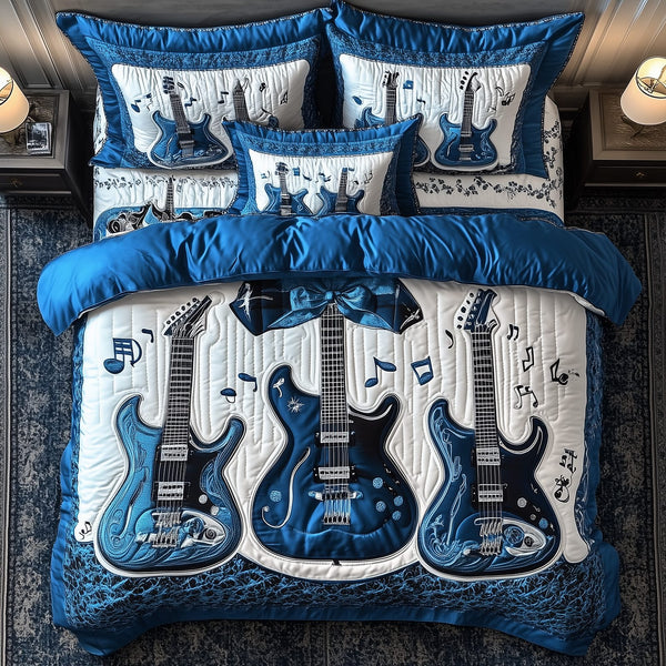 Blue Rock and Roll quilted 3-piece bedding set on a made bed with two matching pillow shams