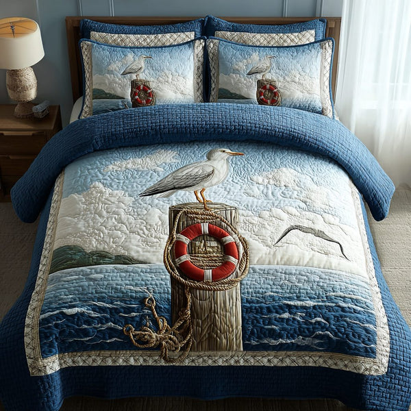 Blue Seagull quilted 3-piece bedding set on a made bed in a light coastal bedroom