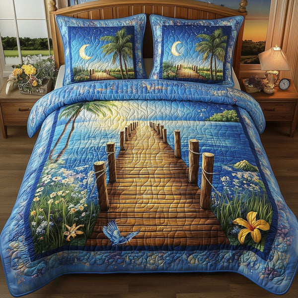 Blue Serenity quilted 3-piece bedding set on a made bed with two matching pillow shams