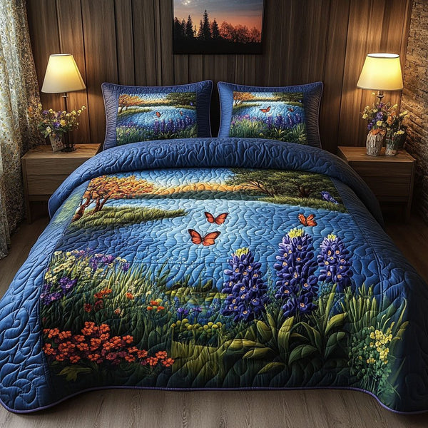 Blue Serenity quilted 3-piece bedding set on a made bed with two matching pillow shams
