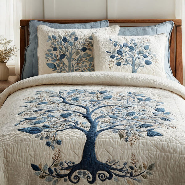 Blue Serenity quilted 3-piece bedding set on a made bed with two matching pillow shams
