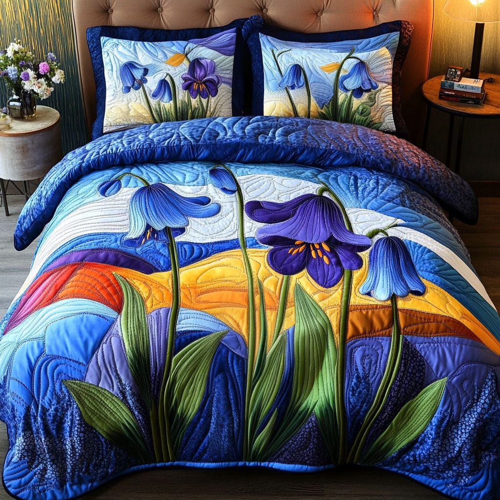 Blue Sky Blossoms quilted 3-piece bedding set on a made bed with two matching pillow shams