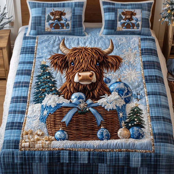 Blue Snowy Basket quilted 3-piece bedding set on a made bed with two matching pillow shams