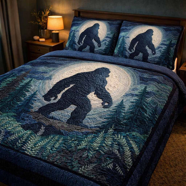 Blue Stalker quilted 3-piece bedding set on a made bed with two matching pillow shams