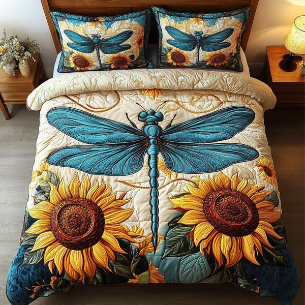 Blue Sunflower Dragonfly quilted 3-piece bedding set on a made bed with two matching pillow shams