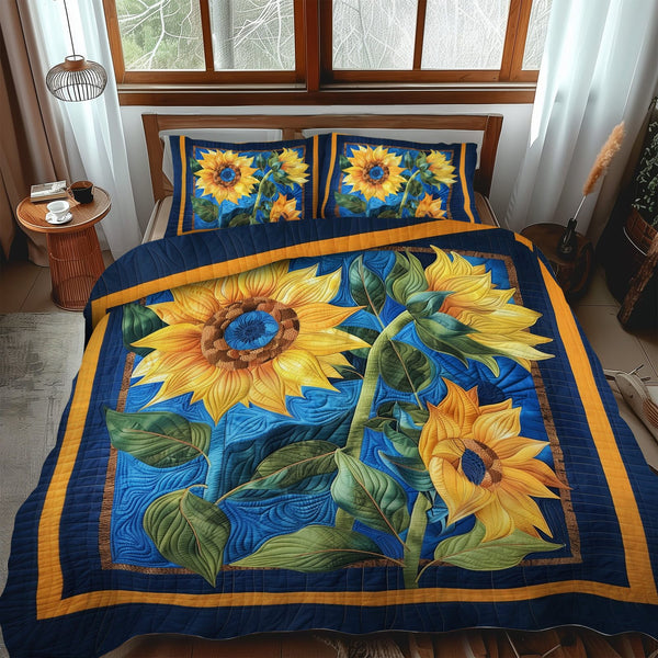 Blue Sunny Bloom quilted 3-piece bedding set on a made bed with two matching pillow shams