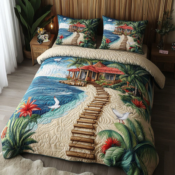 Blue Tide quilted 3-piece bedding set on a made bed in a light coastal bedroom