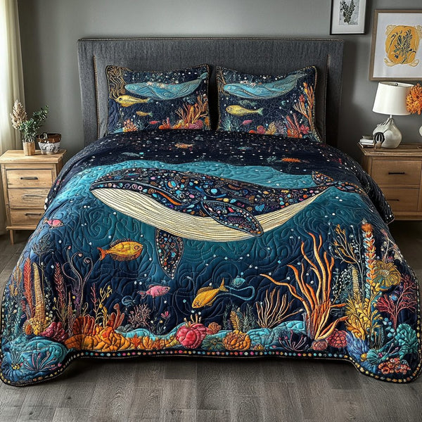 Blue Voyage quilted 3-piece bedding set on a made bed with two matching pillow shams