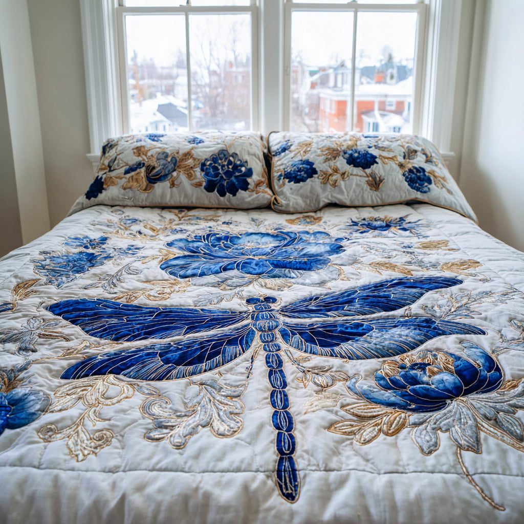 Blue Wing Breeze quilted 3-piece bedding set on a made bed with two matching pillow shams