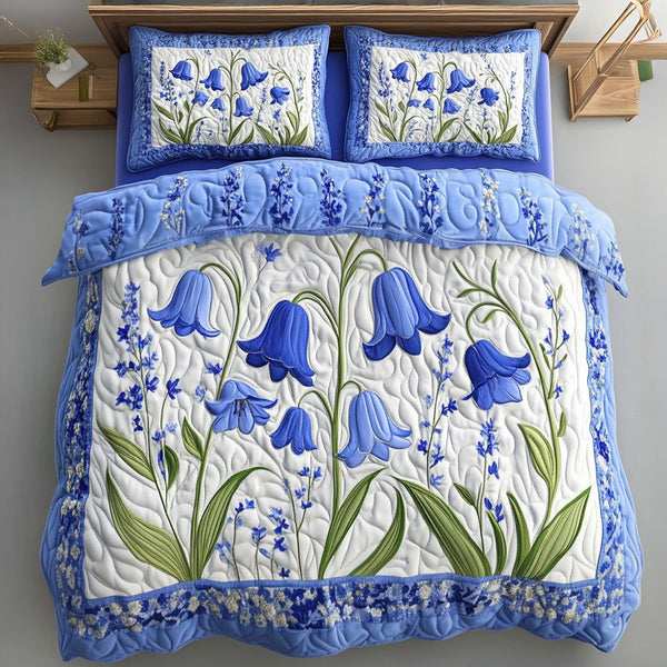 Bluebell Cascade quilted 3-piece bedding set on a made bed with two matching pillow shams