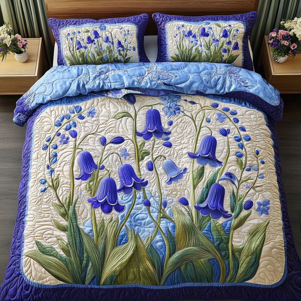 Bluebell Charm quilted 3-piece bedding set on a made bed with two matching pillow shams