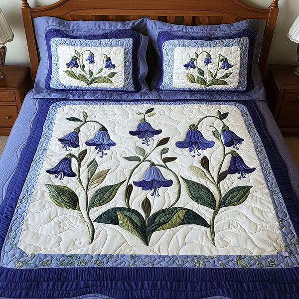 Bluebell Valley quilted 3-piece bedding set on a made bed with two matching pillow shams