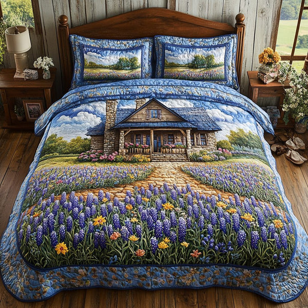 Bluebonnet Beauty quilted 3-piece bedding set on a made bed with two matching pillow shams