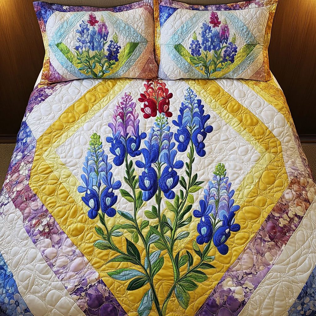 Bluebonnet Beauty quilted 3-piece bedding set on a made bed with two matching pillow shams