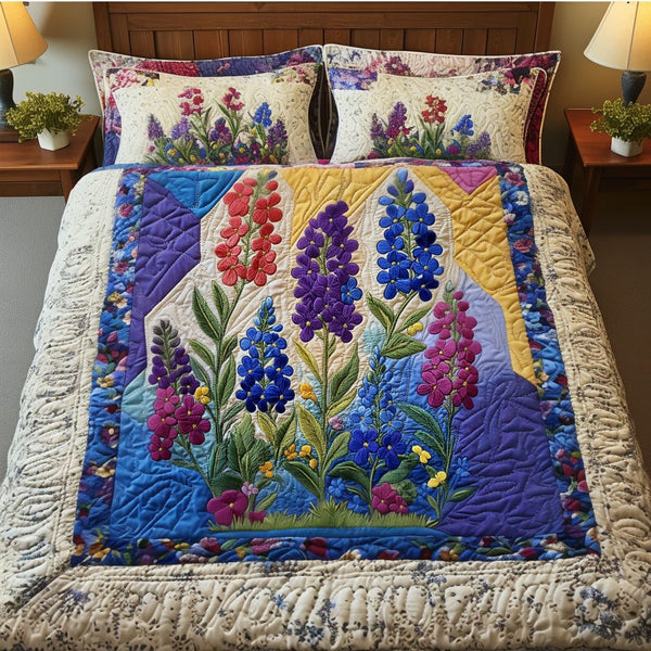 Bluebonnet Bliss quilted 3-piece bedding set on a made bed with two matching pillow shams