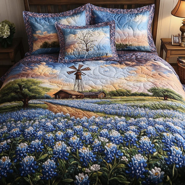 Bluebonnet Charm quilted 3-piece bedding set on a made bed with two matching pillow shams