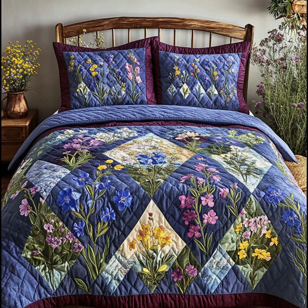Bluebonnet Charm quilted 3-piece bedding set on a made bed with two matching pillow shams