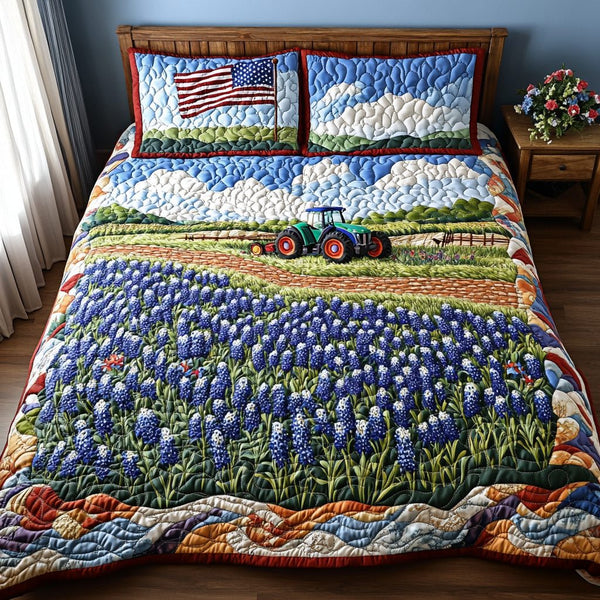 Bluebonnet Essence quilted 3-piece bedding set on a made bed with two matching pillow shams