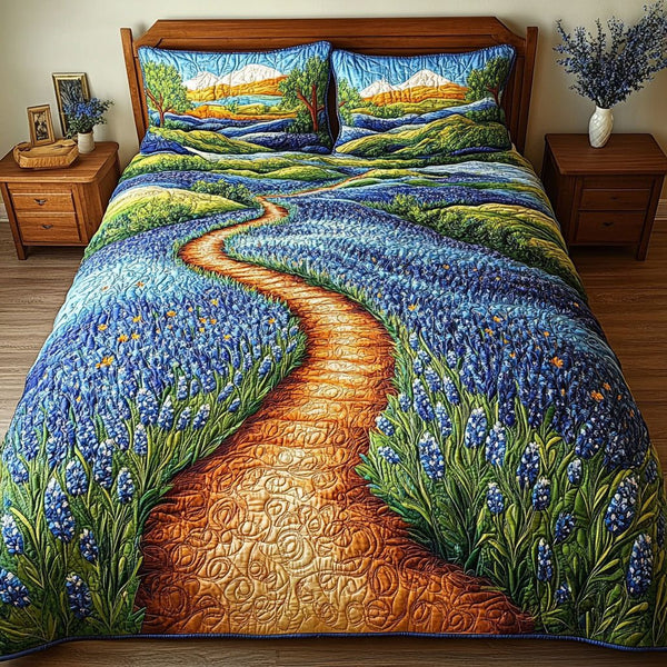 Bluebonnet Hills quilted 3-piece bedding set on a made bed with two matching pillow shams