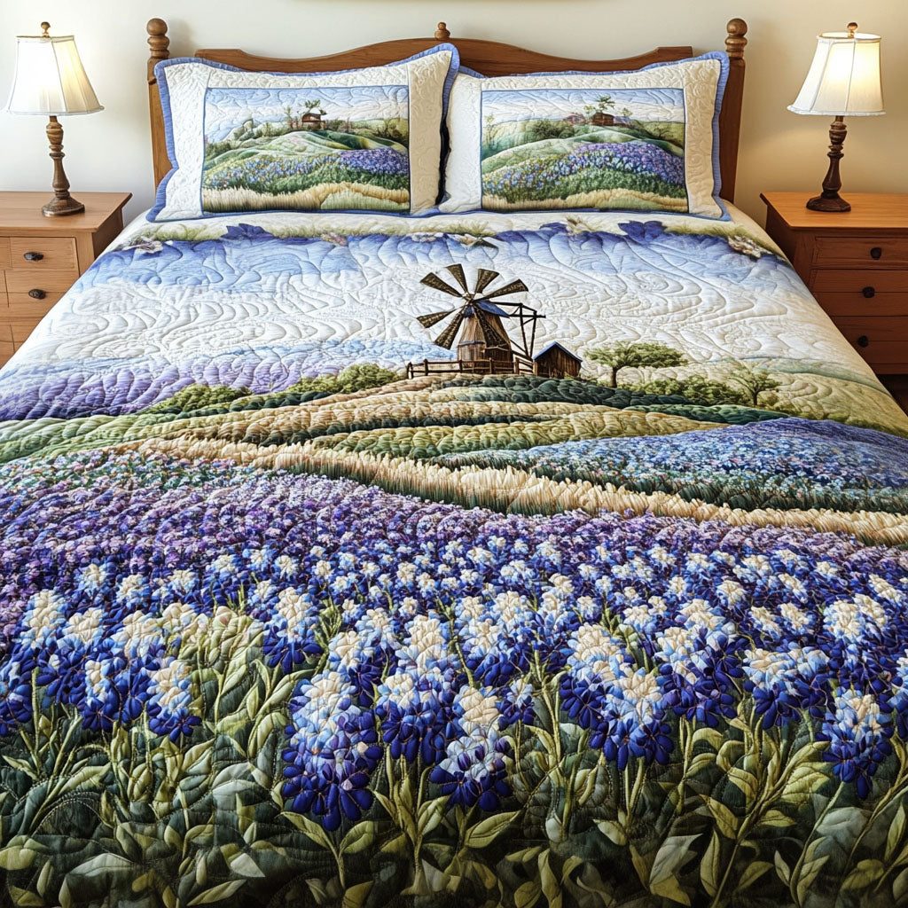 Bluebonnet Serenity quilted 3-piece bedding set on a made bed with two matching pillow shams